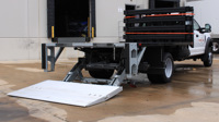 Galvanized Tuckunder liftgate installed on a flatbed work truck