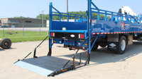 Bi-Fold Railgate in the down position on a stake truck